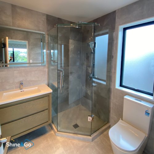 Ensuite bathroom with corner glass shower cleaned by Shine&Go NZ