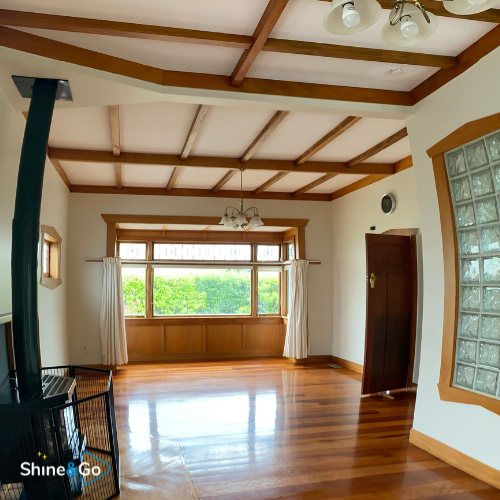 Living room with exposed beam ceiling cleaned by Shine&Go NZ