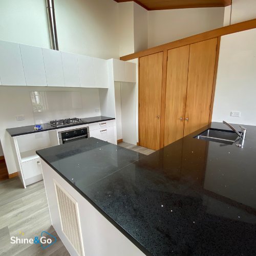 Kitchen with dark stone island cleaned by Shine&Go NZ
